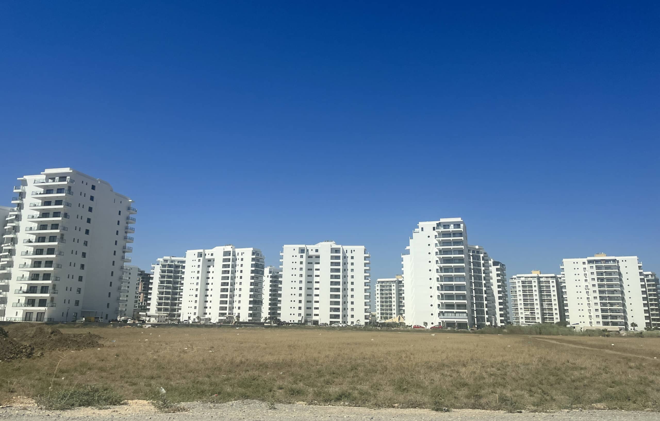 feature-tom-main-The-plains-of-Trikimo-are-coated-with-high-rises-but-the-infrastructure-is-not-in-place-to-support-them-scaled-1