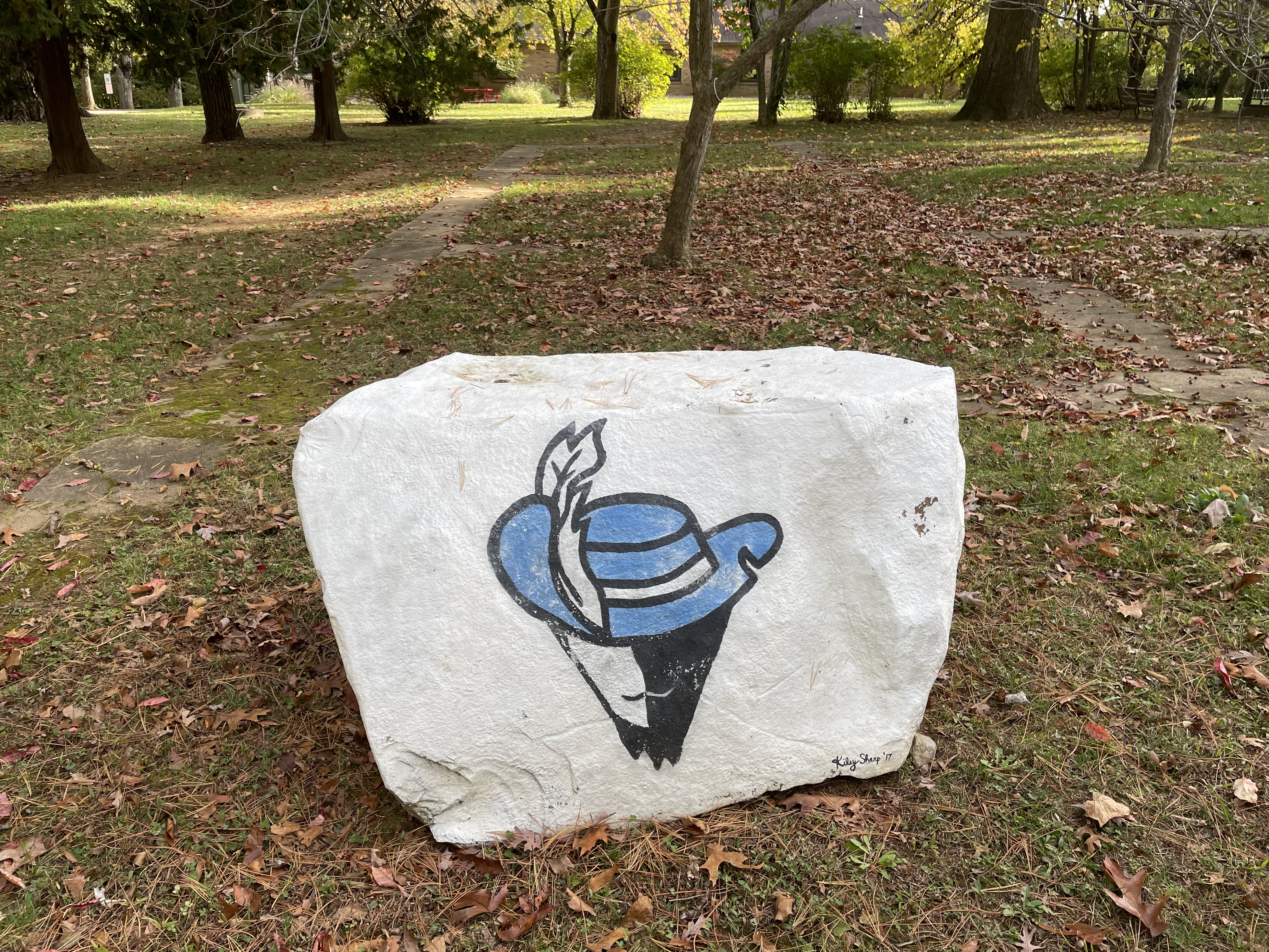 white boulder with a blue Cabrini cavaliers logo 