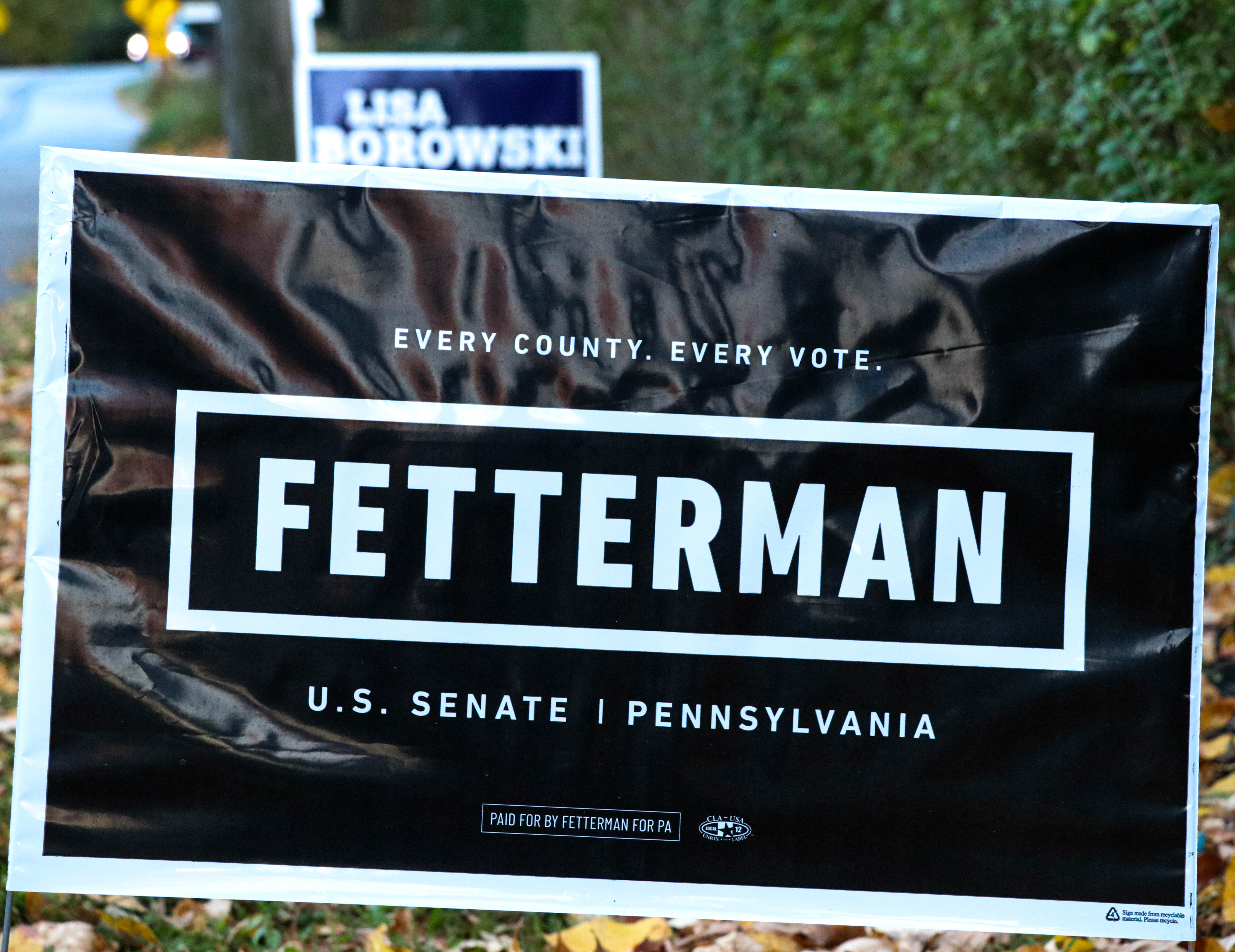 A black sign that says "Fetterman" fills the frame. 