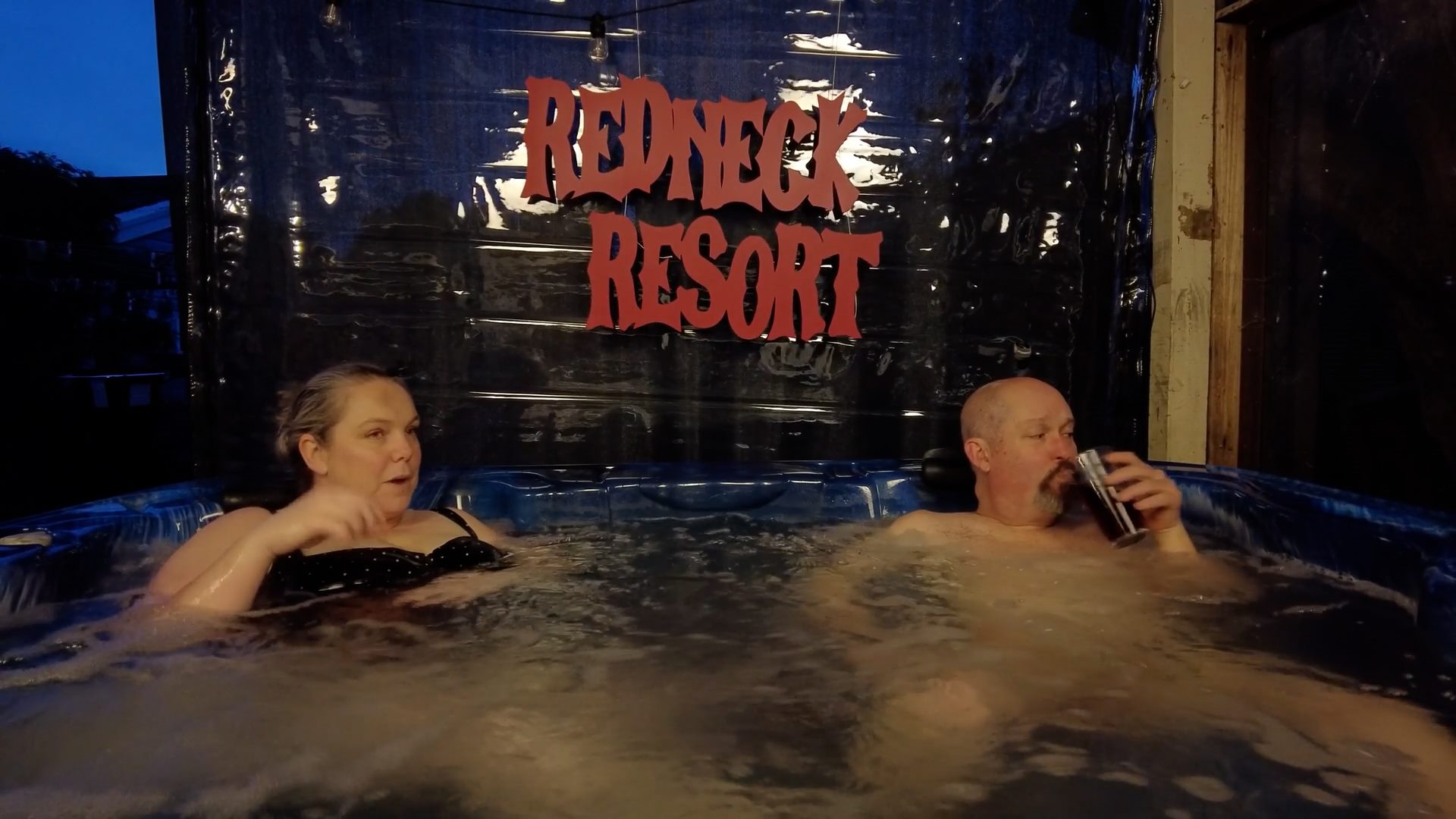 About 2 a man and woman in a hot tub