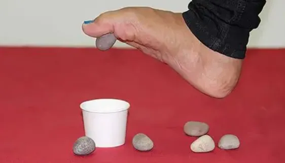 Marble pickup exercise for toe dexterity and strength