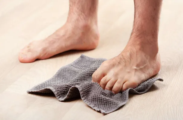 Towel curl exercise demonstration for foot strengthening