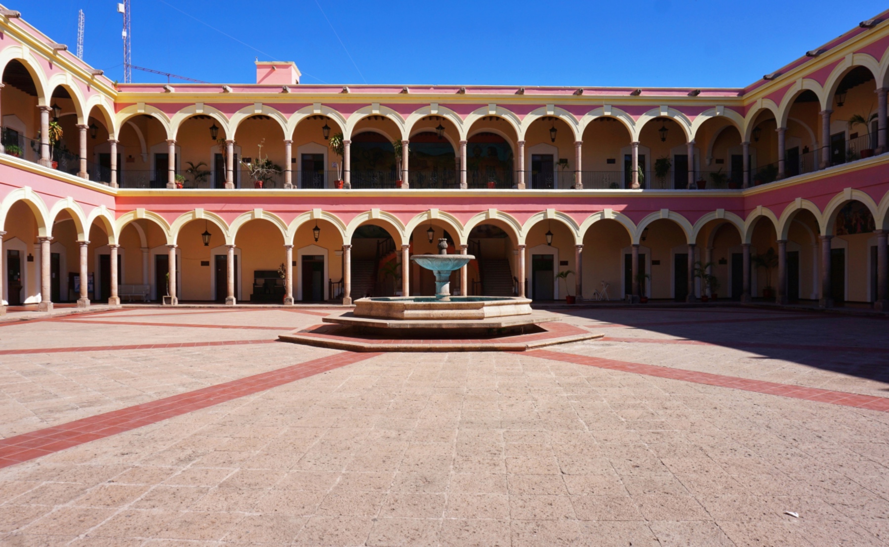 Two-story arcaded courtyard with a fountain in El Fuerte, Sinaloa