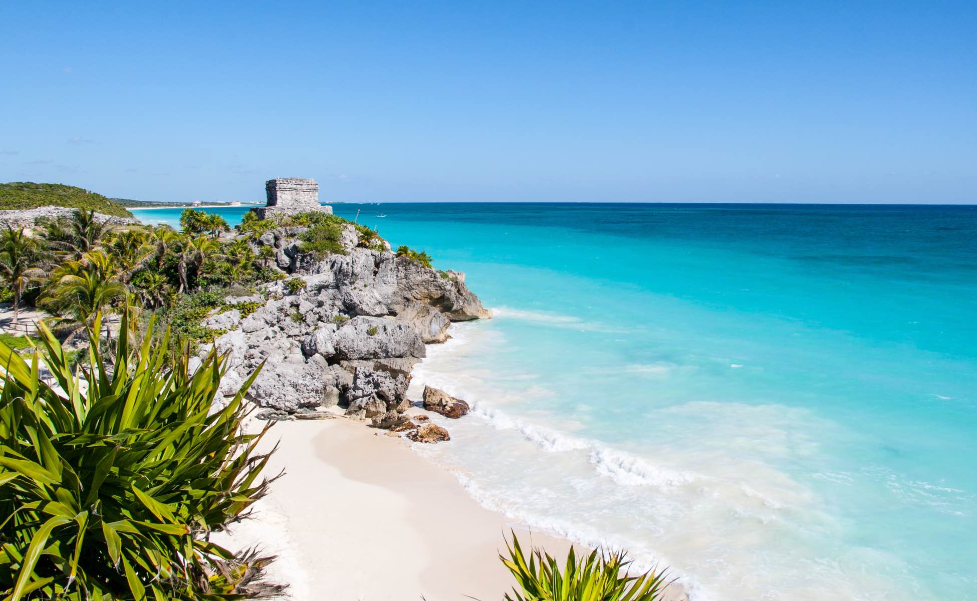 Mayan ruins on a cliff above a white-sand beach in Tulum, on Mexico's Caribbean coast