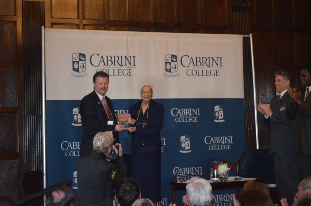 Gloria Richardson accepting award, pictured with President Don Taylor. (Abbie Keefe / Asst. News Editor)