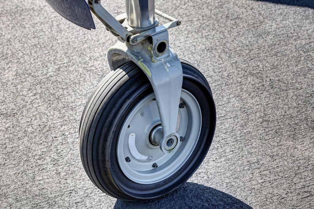 Small jet airplane front wheel on the stand
