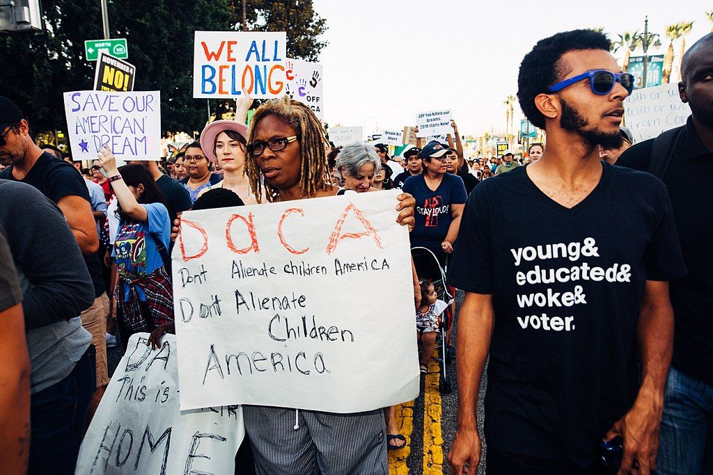 People marching in a protest for DACA rights. Photo by Molly Adams.