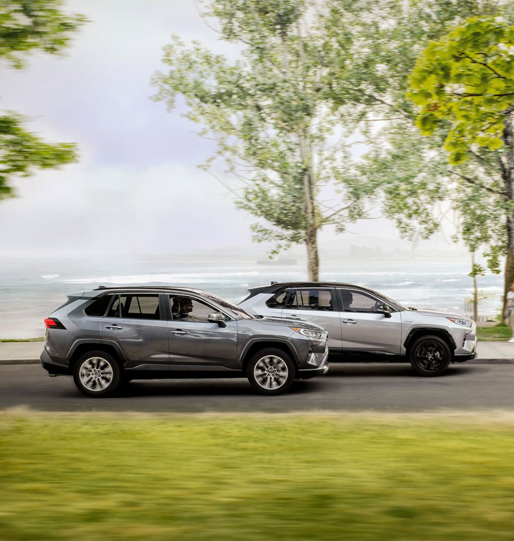 2025 Toyota RAV4 vs 2025 Subaru Forester comparison | Bobby Rahal Toyota | Two 2025 RAV4s driving side by side down a road