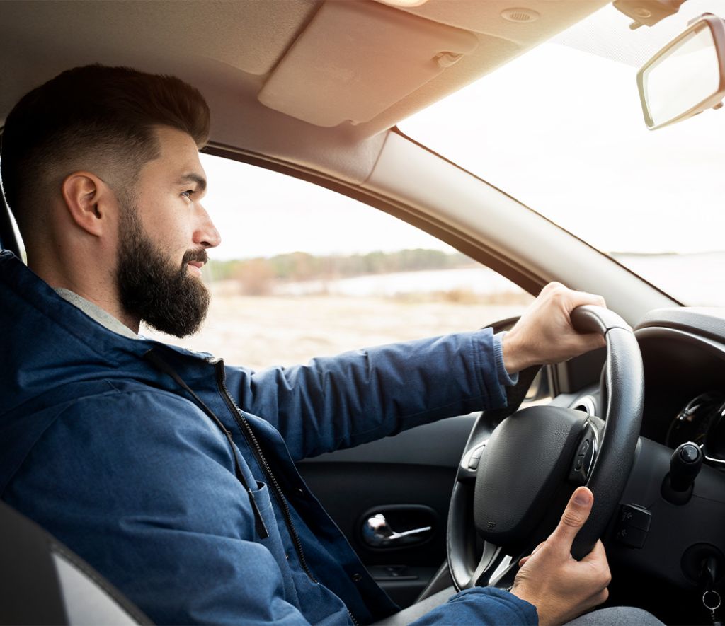 Trade in my leased car at Stetler DCJR in York, PA | Person driving his new car