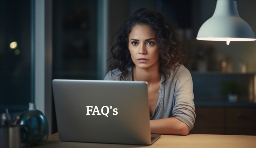 A woman sitting at a table with a laptop and the word faqs on it.