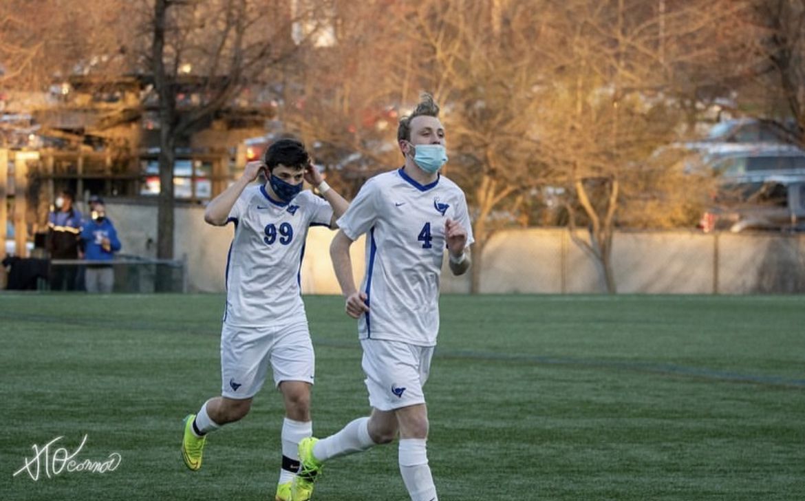 Senior forward, Nick Booth, running off the field. Photo by Tyler O’Connor.