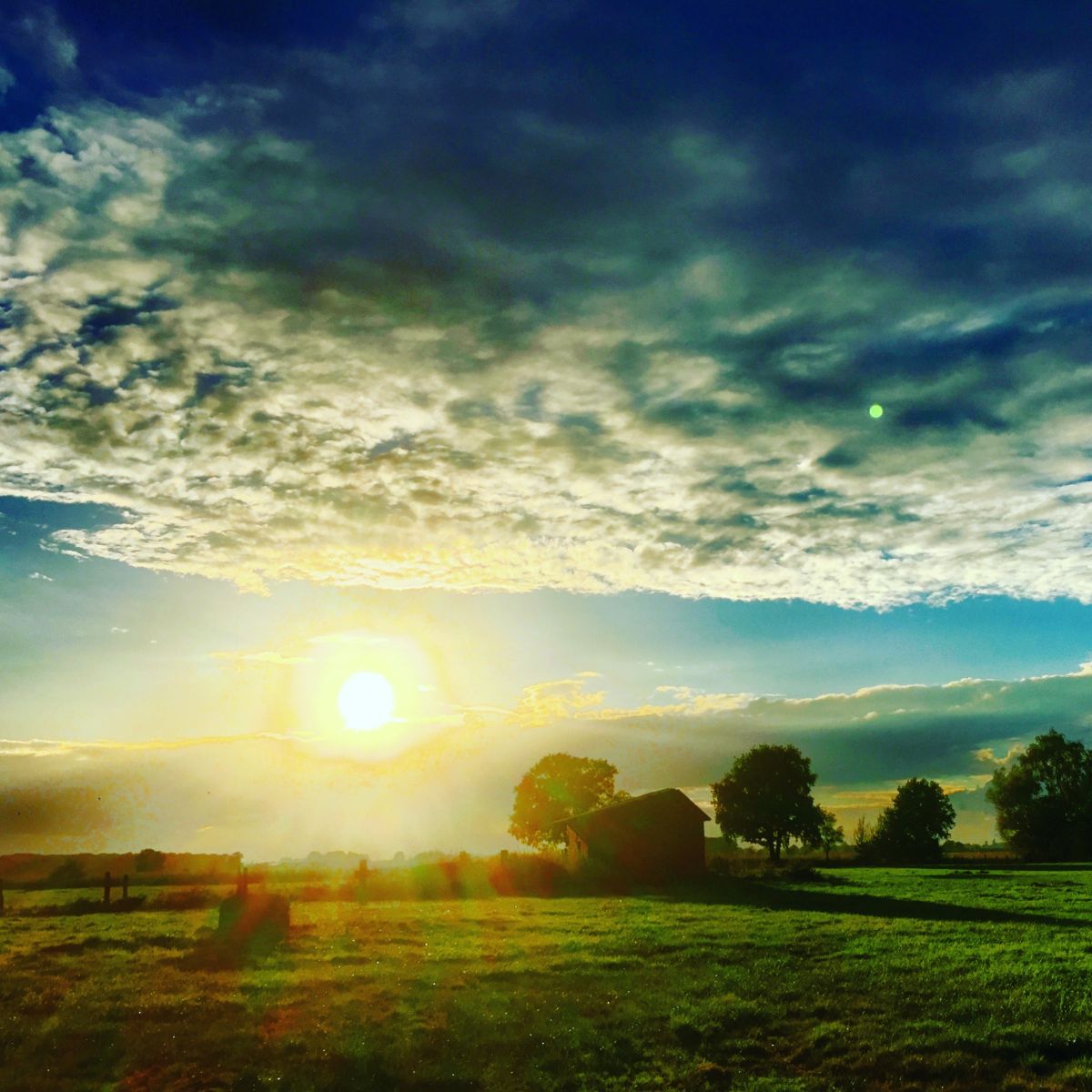 Rural sunrise from under the Clouds