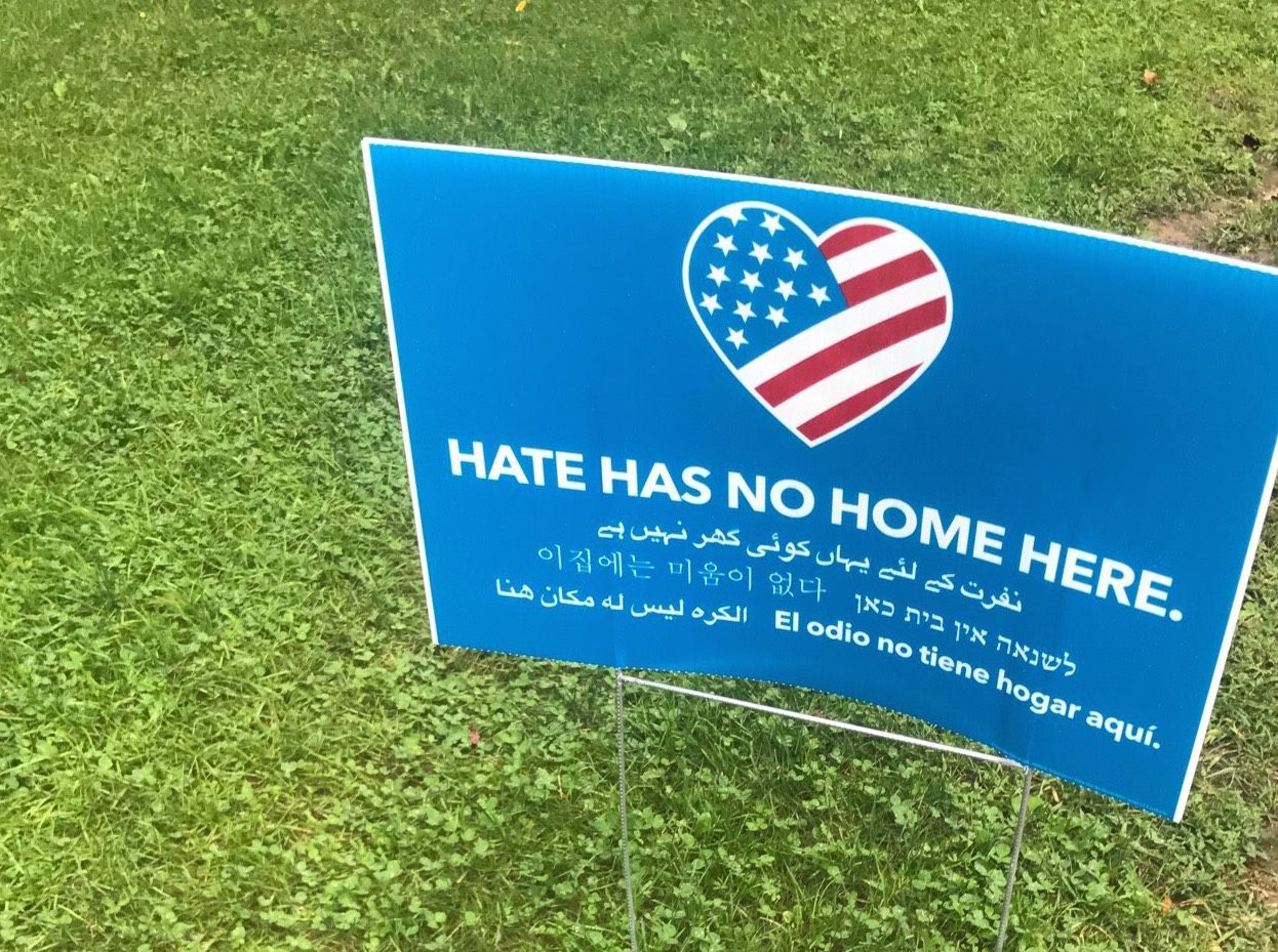 Hate Has No Home Here signs can be found throughout campus. Photo by Laura Sansom.