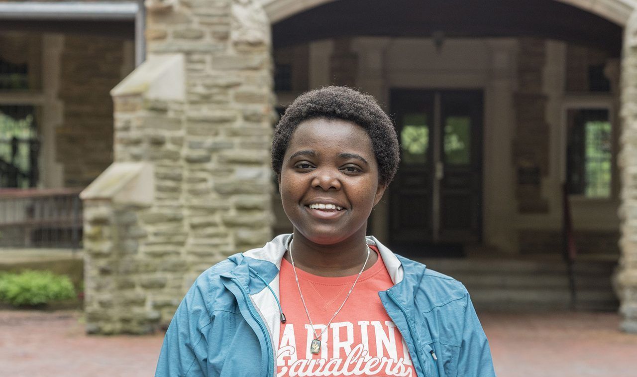 Evarlyne Ndeti standing outside of the Mansion. Photo from https://www.cabrini.edu/about/media-hub/profiles/student-profiles/msc-candidates.