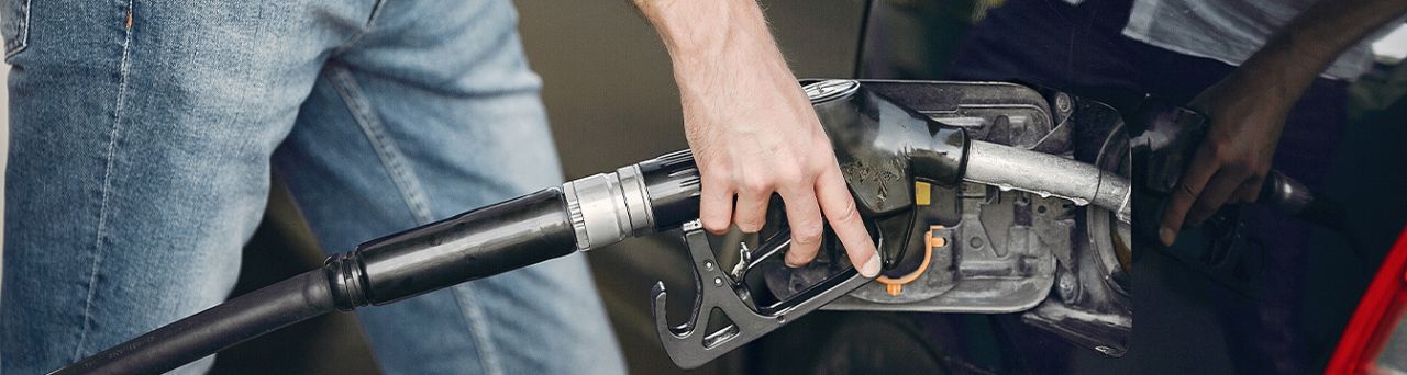 What Type of Gas is Best for My Car? | Team Toyota of Glen Mills in Glen Mills PA | Person putting gas nozzle into gas tank for his car 