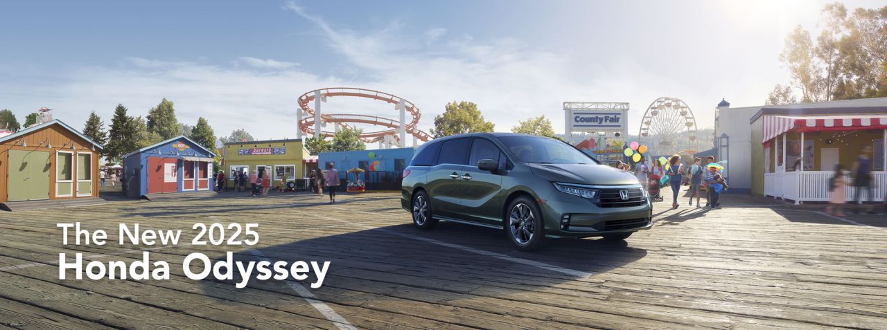 New 2025 Honda Odyssey at Delaney Honda | 2025 Honda Odyssey parked in front of a county fair during the day