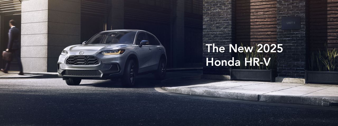 New 2025 Honda HR-V at Delaney Honda | Grey 2025 Honda HR-V driving out into the street