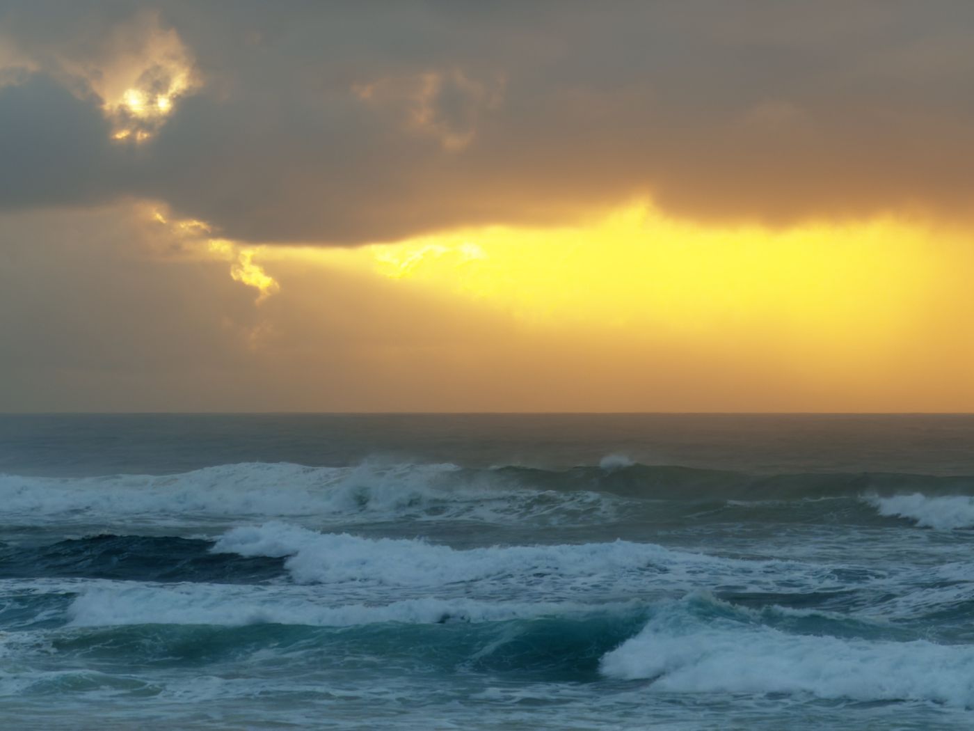 Sunrise over waves