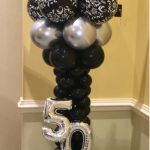 50th celebration balloon column with topper