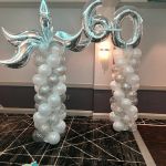 silver/white balloon columns with toppers