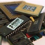A CPU stacked on top of various other computer components. this image was taken by Wolfie Fox