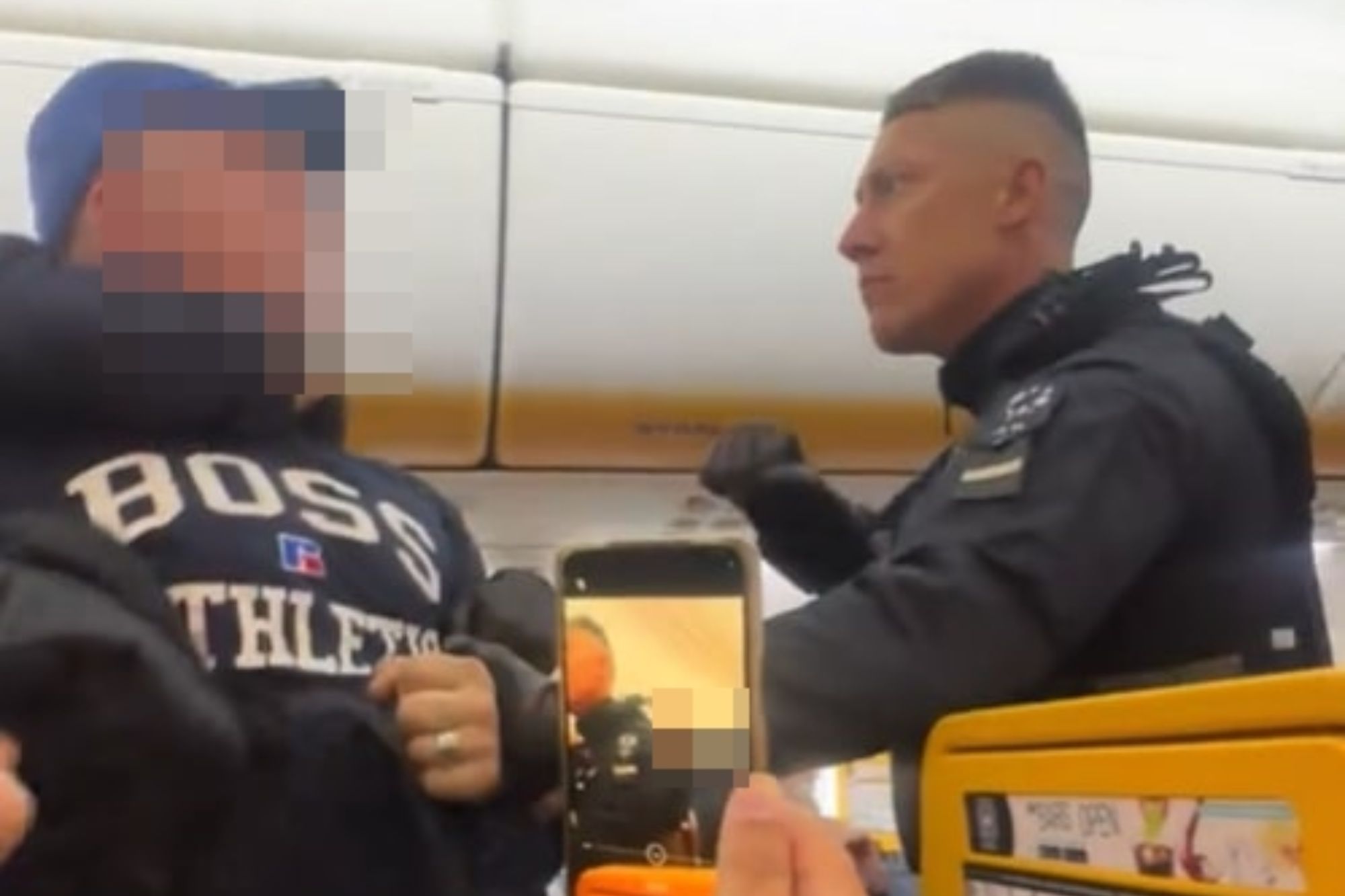 Shocking moment boozy Brit stag do yobs are dragged off Ryanair flight by armed cops after