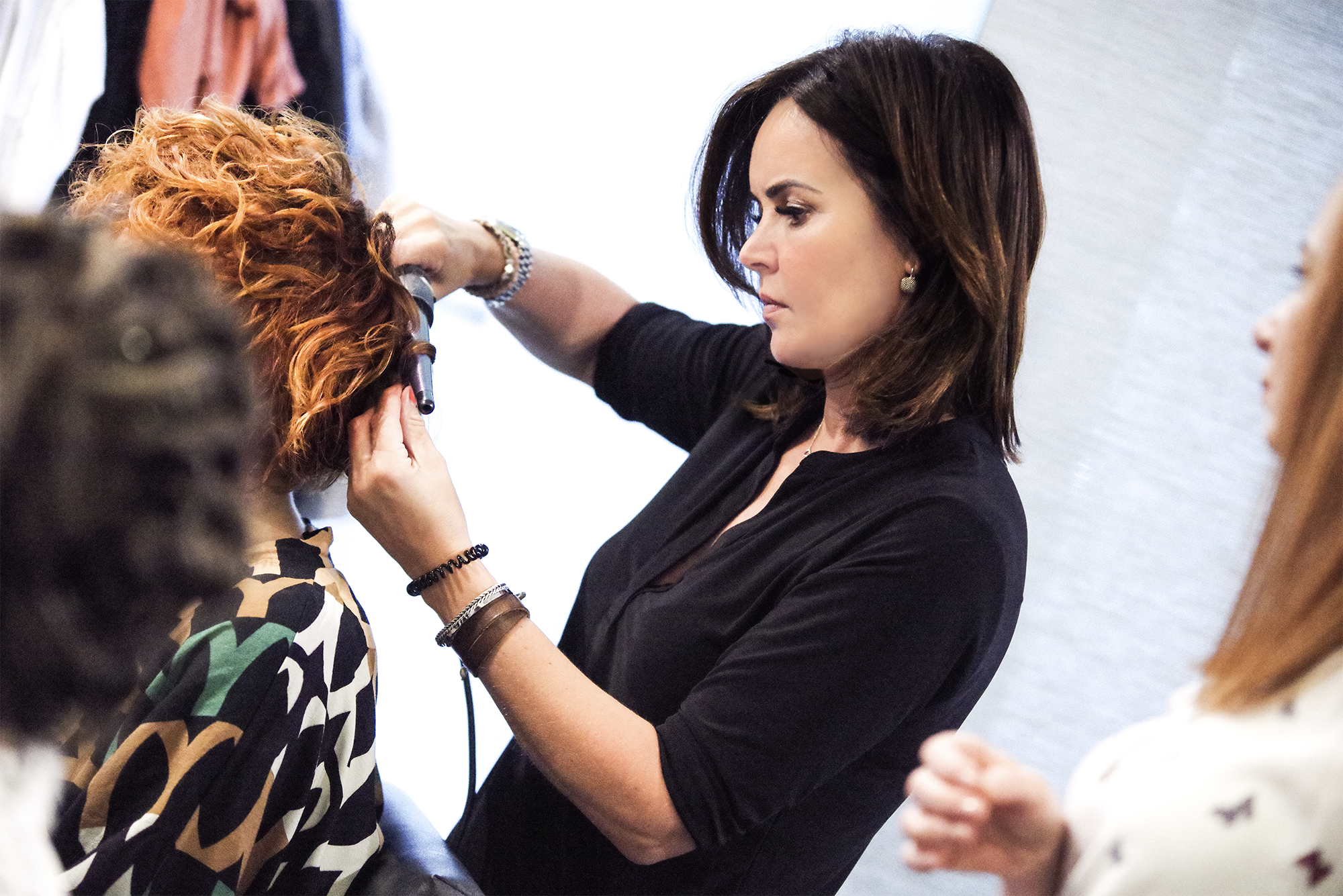 Ginger hair Curl styling in Salon by Miluska Braat Natulique Curl styling by Natulique hairstylist Miluska Braat