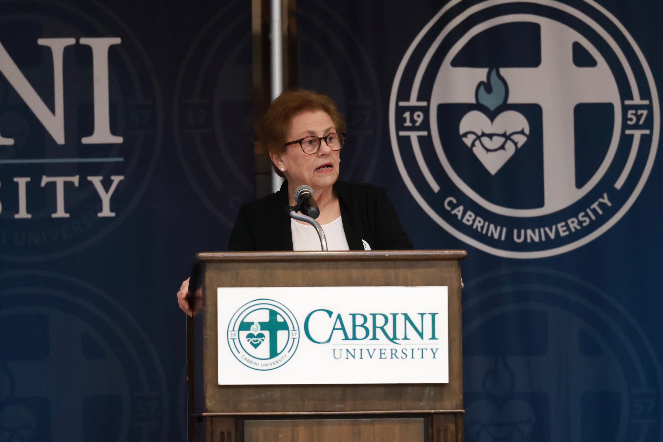 President Helen Drinan speaking at Cabrini Day