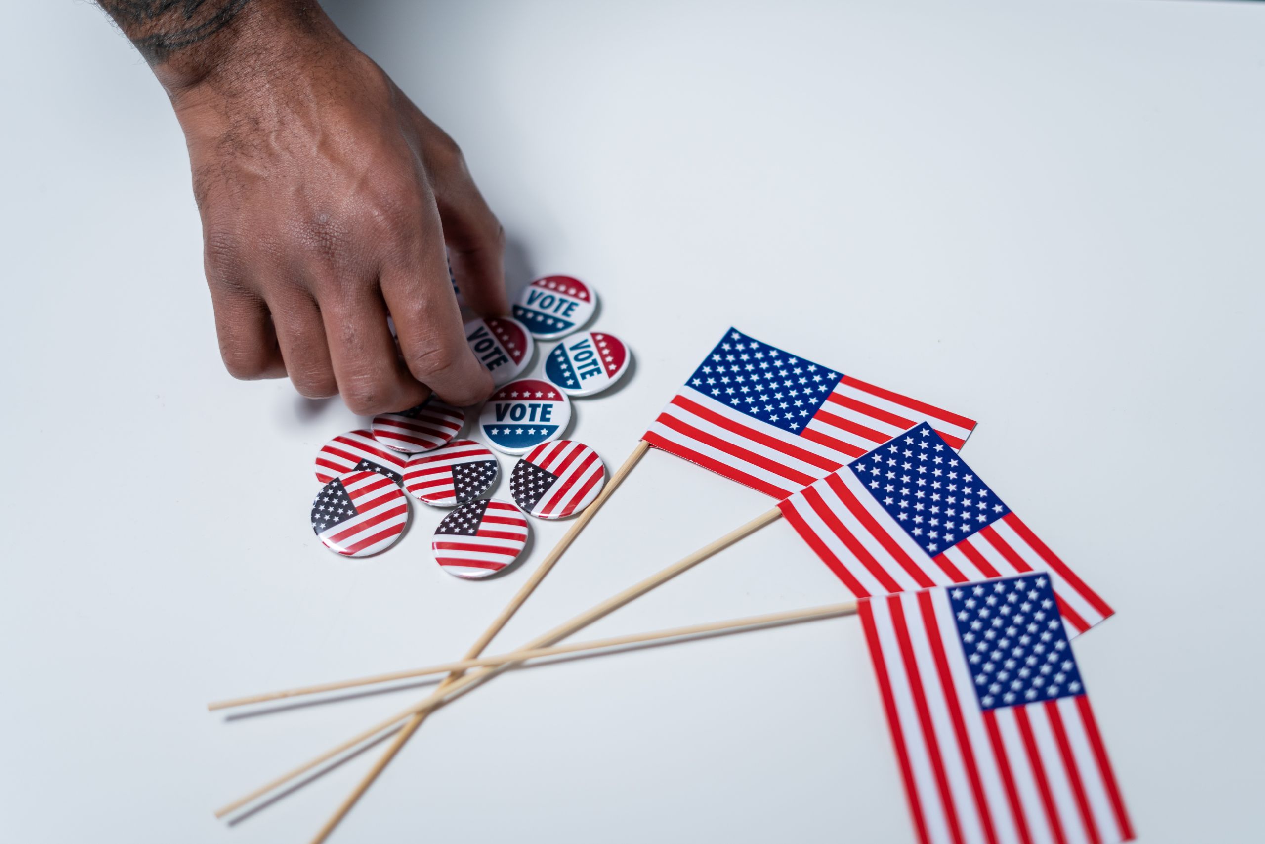American flags and pins on white background.
