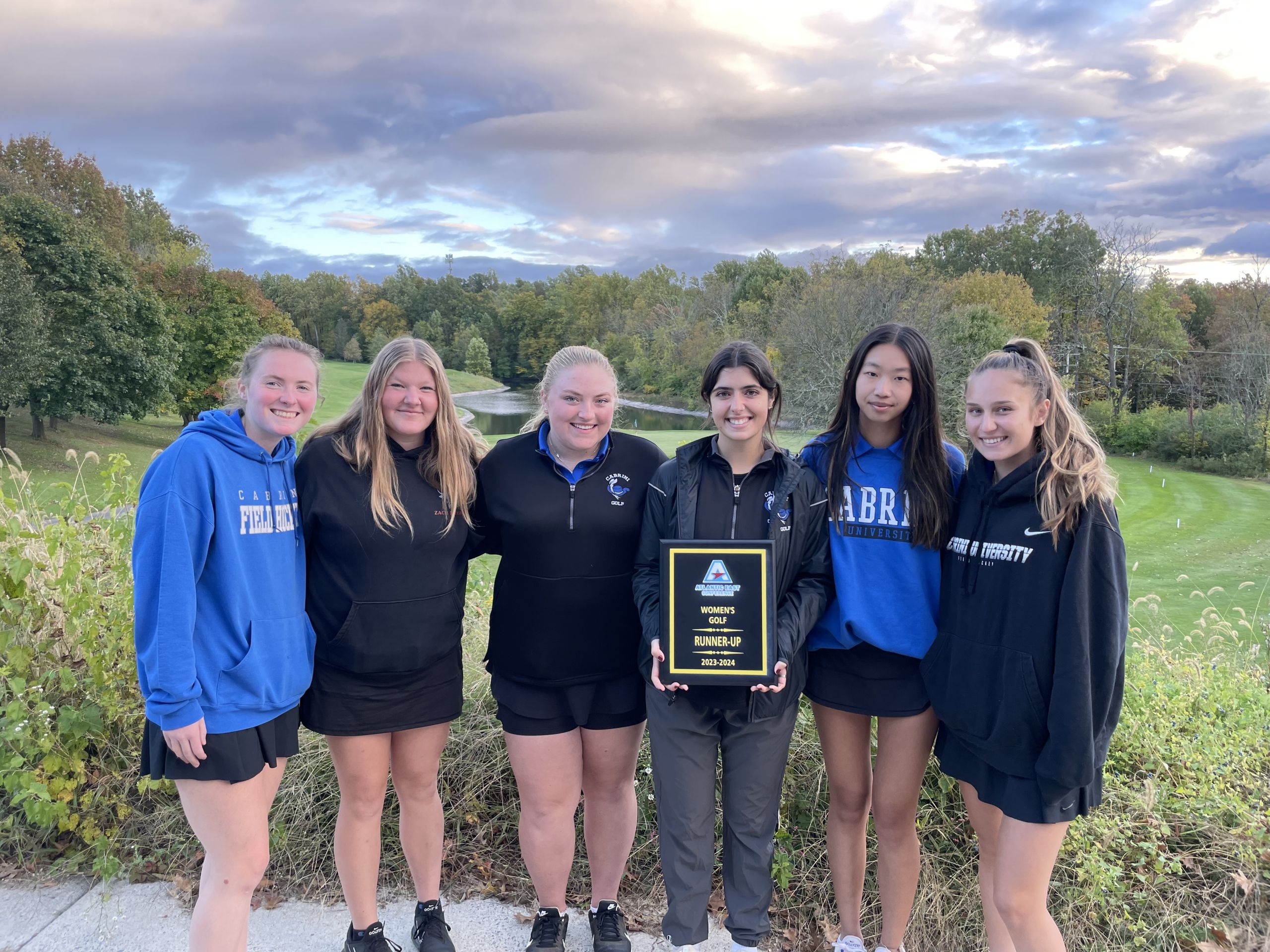 Members of the women's golf team pose with the runner-up plaque. Photo courtesy of Ashley Ea. 
