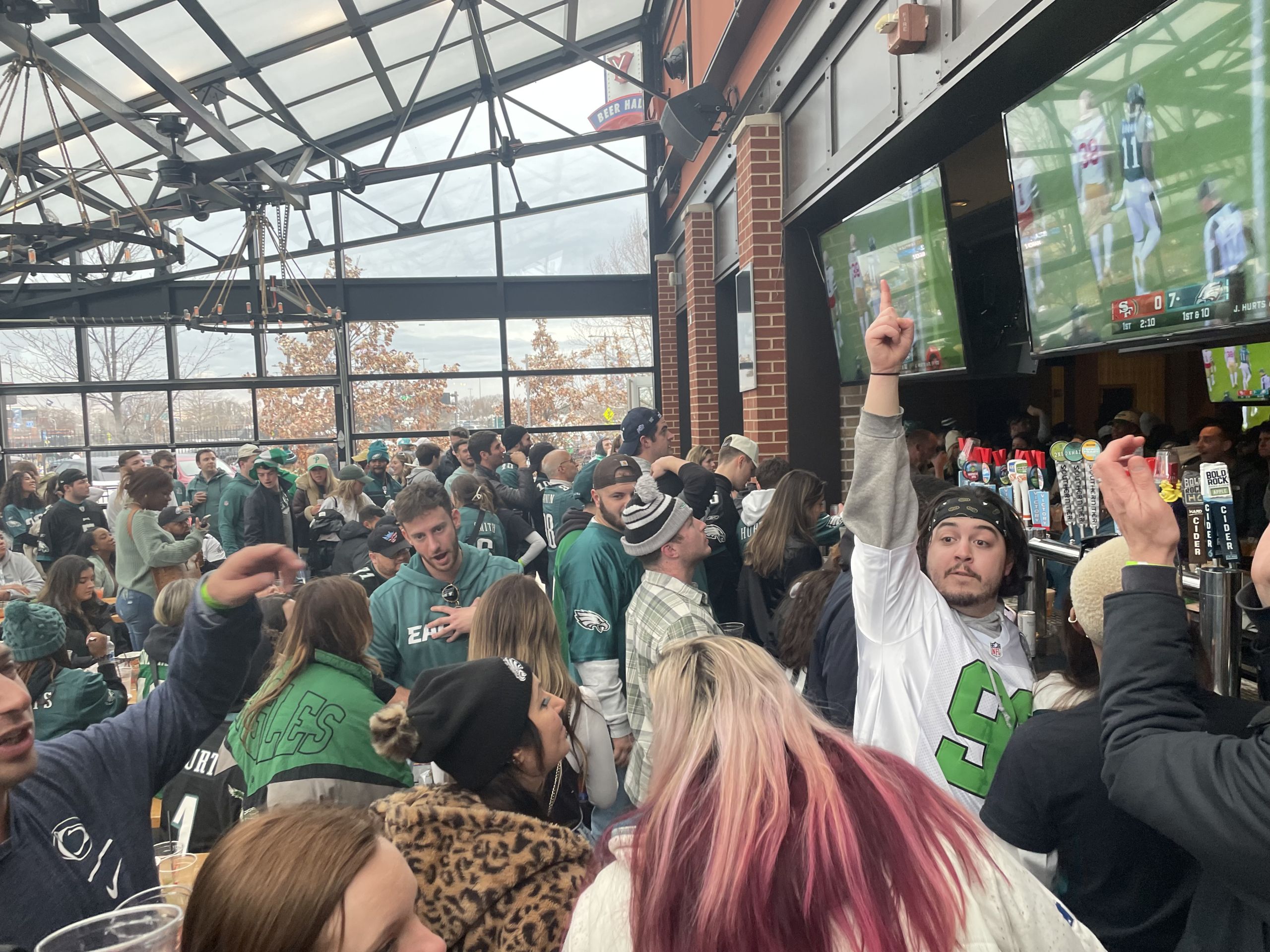 Fans celebrate the Eagles playing in the NFC Championship at Xfinity Live. Photo by Kelly Kane.