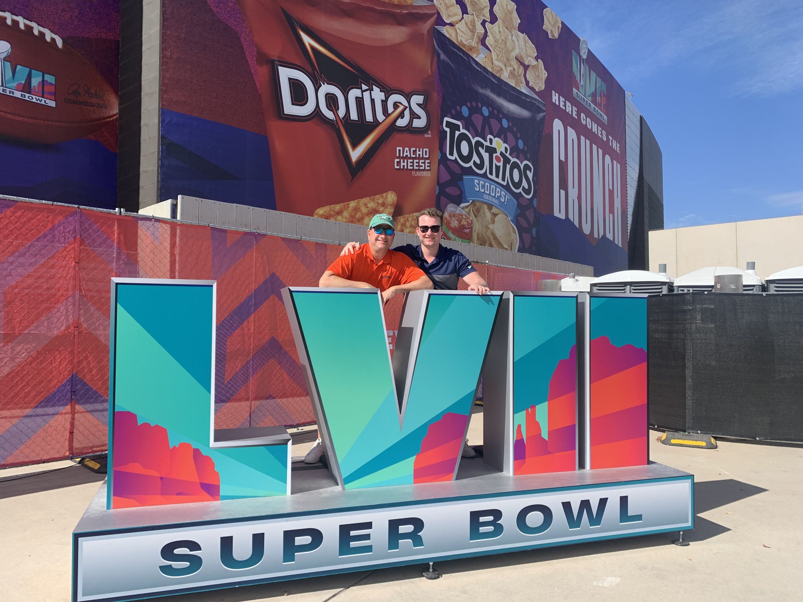 John Rader IV (L) pictured with his father, Cabrini Class of 1988, John Rader III (R) at the Super Bowl Experience in Phoenix, Arizona. Photo from John Rader.
