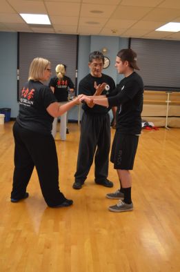 Sifu Lan and Dr. Watterson work on basic body principles with Nattie