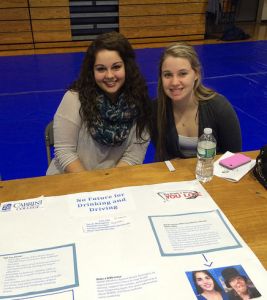 Danielle Pasqua and Sarah Monaghan present their poster about drunk driving on Cabrini Day on Tuesday, Nov. 11. (Sam Jacobs/Staff Writer)