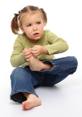 A little girl with a sore foot