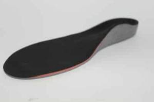 A grey orthotic with black cover