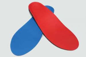Two orthotics overlapping each other red and blue