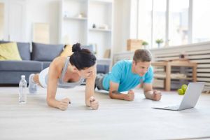 Two people working out at home