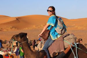 Milano on her camel in Morocco.