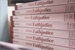 Copies of Kammer’s book “Doing Faithjustice.” (Denine Rohanna /Staff Photographer)