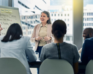 Shot of a mature businesswoman giving a training presentation.