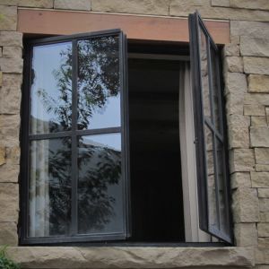 steel framed windows in stone opening 