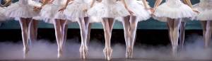 A row of ballet dancers en pointe