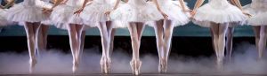 A row of ballet dancers en pointe