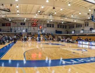 Cabrini's women's basketball team competing in a game. Photo by Cabrini University Flickr.