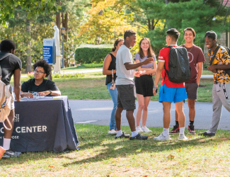 Students at the voting registration table hosted by the Wolfington Center.