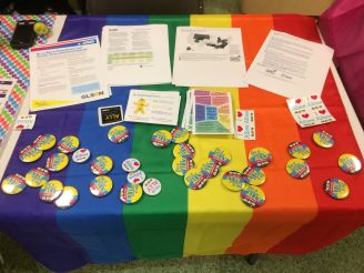 This table was set up to educate students on "Coming Out Day" and how to be an Ally. Photo by Vanessa Charlot.