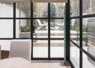 Glass Box Extension from the inside, black glazing bars and frame
