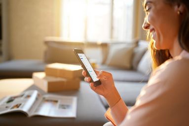 happily monitoring her improved credit score