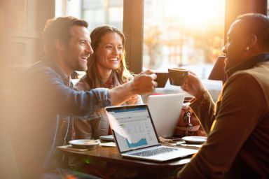 group of friends celebrating their improved credit score
